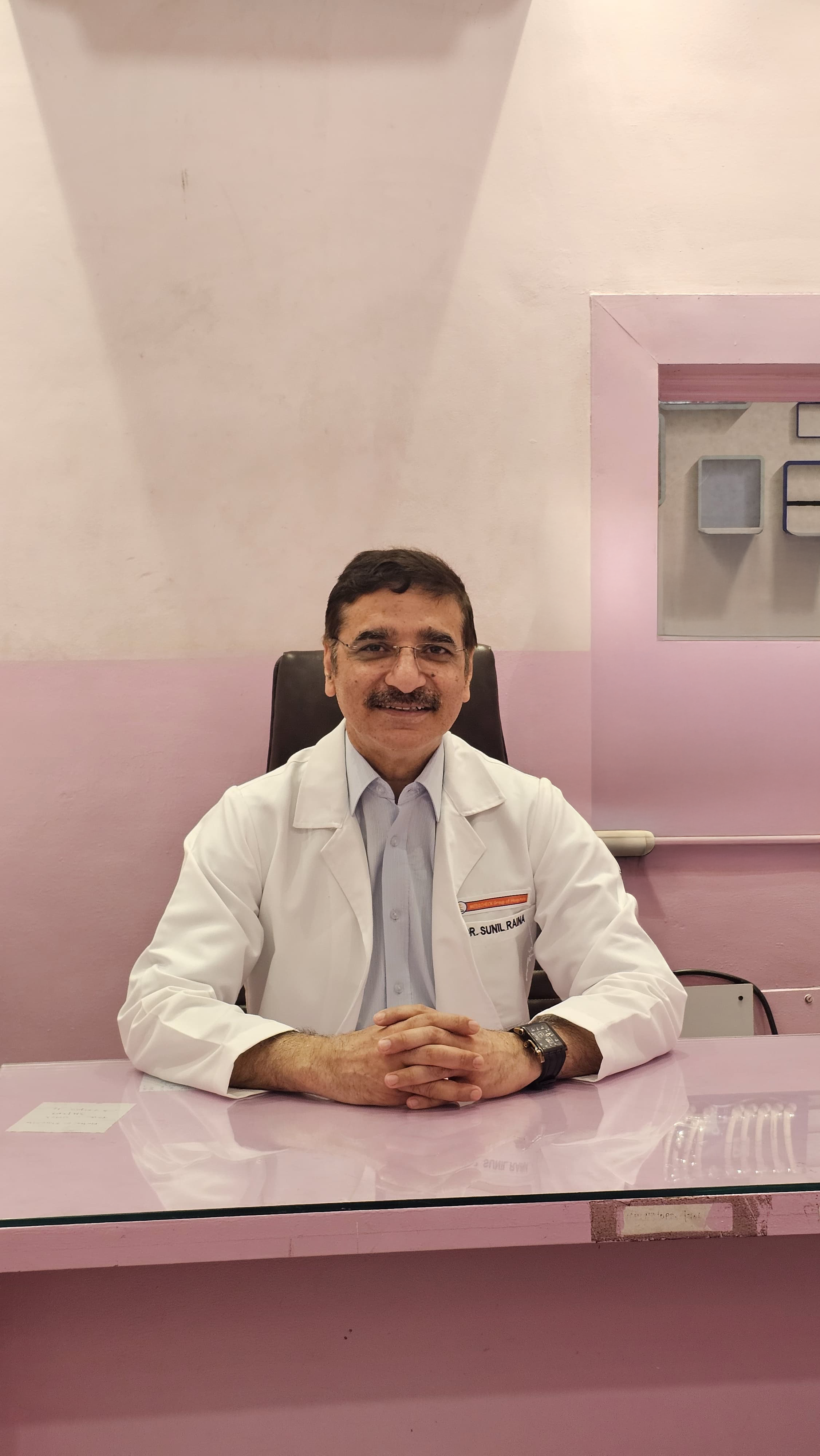 Dr. Sunil Raina
